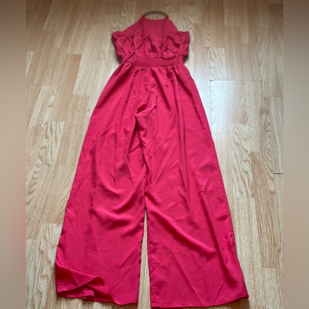 Pink wide leg jumpsuit with ruffles with gold necklace